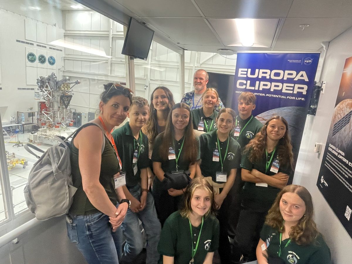 the Ronan Middle School team stands above the Europa Clipper clean room at the Jet Propulsion Laboratory